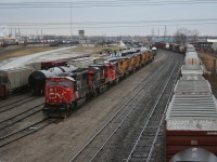 The power off CN 332 lays over at Sarnia, waiting to go out later in the evening on a 370. The 6 ex-Union Pacific locomotives are the first of what will become CN's new 2000 series.