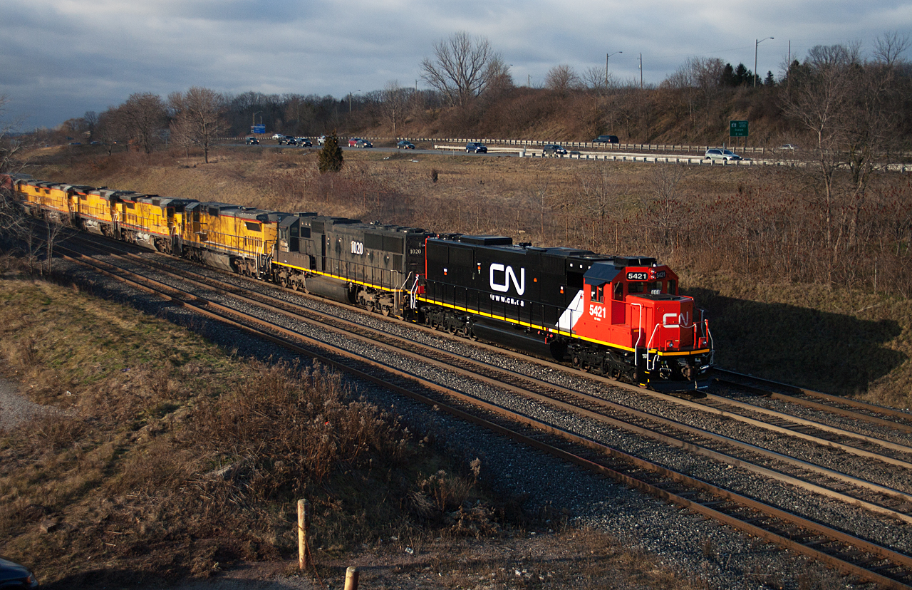 CN 396 passes through Aldershot with CN 5421, IC 1020, CREX 9056, 9033, 9037, 9043, 9027.  The CREX units will be renumbered into the CN 2000 series at MacMillan Yard.