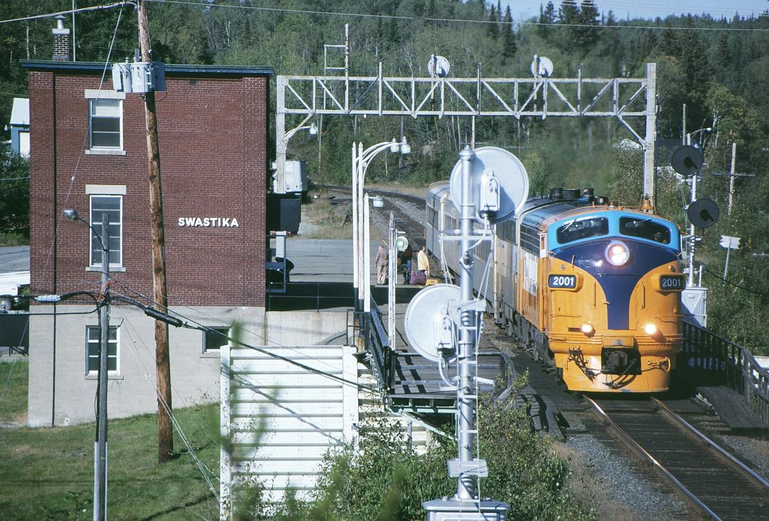 ONR 2001 with the south bound 122 on the ONR Ramore sub prepares to leave Swastika, ONT  9/20/1996

Here is my Youtube video of the same shot, Enjoy... 
http://www.youtube.com/watch?v=2i5f_eimqYk