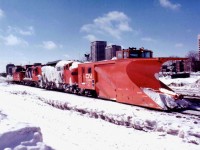 CN Plow Extra running in an eastward direction thru London back in March of 1978; Plow is #55614, power is CN 9179, 4530 and caboose 79874.  Winter is beginning to fade, the snow looks old with a new dusting to give the scene some freshness.  I am not exactly sure where this image was shot, I can only remember somewhere east of downtown; as the skyline has changed dramatically since. The F7Au was one of a series all retired by 1989. Assume it went for scrap.