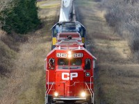 DIM-004, a train of Windmill Blades destined for unloading at Welland, Ontario is cresting the Niagara Escarpment at Vinemount, Ontario. Trailing the lead unit is ICE 6415.