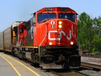 CN heading East with some speed on a nice day 