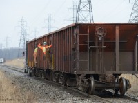<b>Strong Man</b> - Posing for the camera, this employee takes pause as they are moving to the next destination to dump more ballast on the CN St. Clair River Spur in Sarnia.