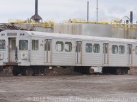 <b>Hamilton's New Light Rail? </b> - If this was Hamilton Light Rail it would surely look at home, but instead this is the end for TTC Hawker-Siddeley H5 5735 as it awaits its turn for scrapping at Future Enterprises. This facility had the following on the property on this day: 5735: 5717, 5786, 5805, 5713, 5607 - (and there may have been a couple more that I missed!)<br><br>As of December 2012 you can hardly tell there was ever a scrap yard here - and the company appears to have gone out of business - phone numbers no longer work, and all of the cars mentioned above (many seen in the background of this photo) are of course, long gone.