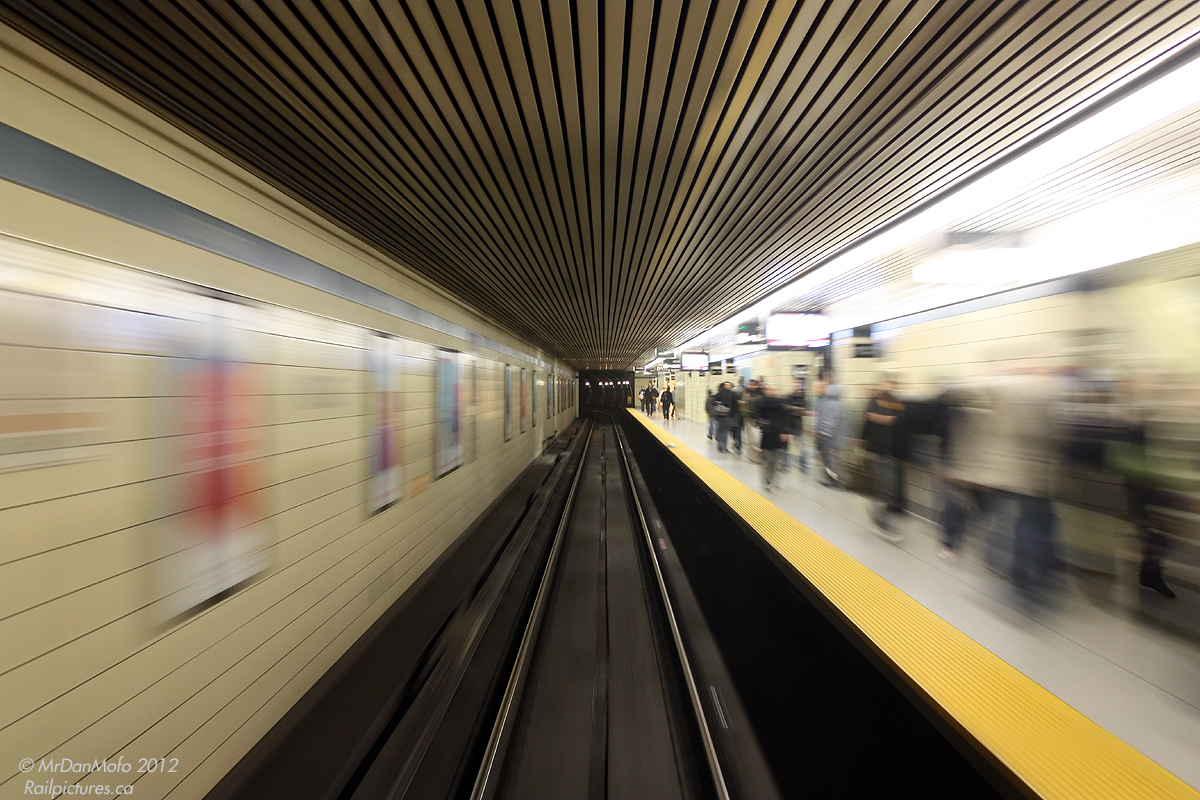 Leaving the rush hour crowds on the narrow platforms behind, our subway train accellerates out of Yonge Subway Station, heading west on the Bloor-Danforth line.