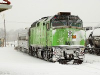 VIA #73 with Telus wrapped 6429 pushing on the rear departs Brantford about 40 minutes late during a heavy dumping of snow