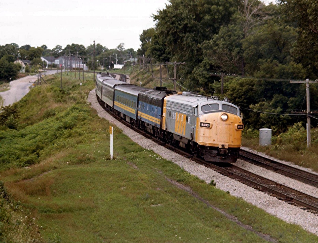 Back in the summer of 1980, word got around that VIA was testing a new paint scheme. And on this overcast August day the opportunity to capture an image of this one-of-a-kind made itself presentable. So here we have VIA 6532,6630 on an eastbound VIA #72, the leader in my opinion looking as nondescript as the weather. I don't know how long this scheme adorned 6532, but I never saw it again.
Photo taken in the company of fellow Railpictures contributor James Adeney, who also captured this scene,  next to the old John Ave overpass in Paris, Ont., gasp, over 32 years ago already.