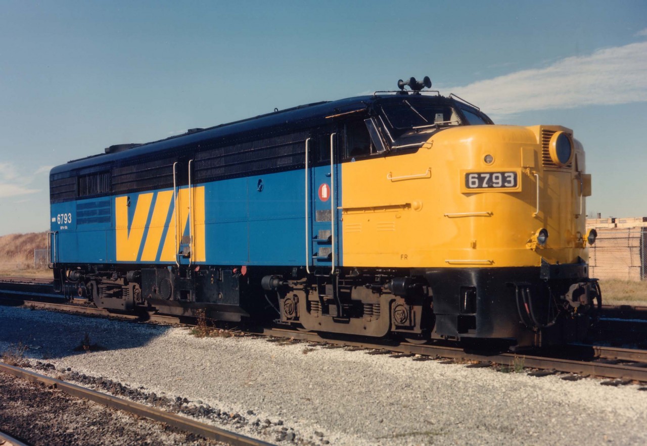 I'm not usually much for roster shots (or submitting them) but the fact that someone left VIA 6793 behind at the Niagara Falls VIA station was a bit too much to resist.
Just in time before the shadow lengthened, this image was captured with Kodak Vericolor III 400 IS0 sheet film at 250/f11 with the trusty old 4x5 Speed Graphic.