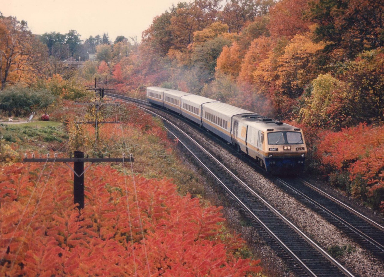 It is the height of fall colour, this October 16, 1986 as VIA 6917 powers an eastbound passenger around the curve from Bayview Junction toward the station at Burlington West.
Photo was shot from the Beth Jacob Cemetery bridge close to a CN railroad location now known as 'Snake".
The 6917, retired by 2002, was purchased by the Toronto Railway Historical Association in 2010.