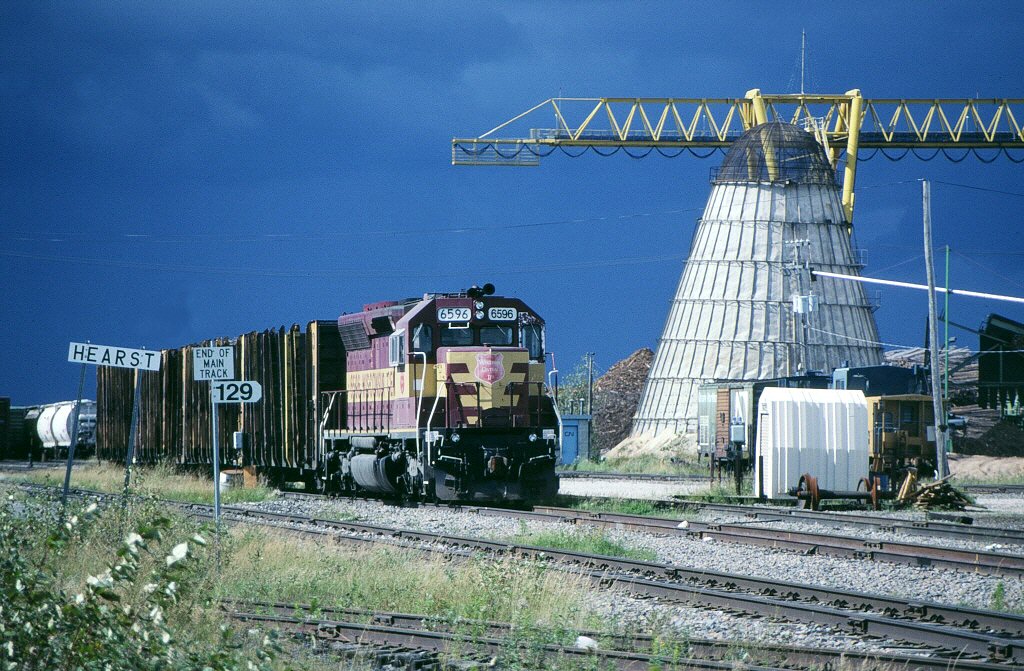 WC SD45 6594, at Hearst, ONT. 9/13/1994

We headed north from the CP at White River, Ont. to catch the CN action at Hornepayne. After about 5 trains, the storms come ripping through. So we figured on heading north, and then east to Hearst. This is about as far north that you can drive in northern Ontario. When we arrived at Hearst, the storms where right on our tails, and closing in fast. With the last glimpse of the sun, I captured the WC 6594. Then all hell broke loose. We then made a bee-line for Cochrane, and caught the Kapuskasing job in beautiful sun. But the storms where not far behind us...