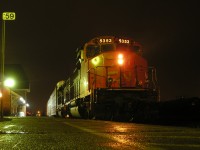 CN 5353 idles in front of the VIA Rail Station in Sarnia, Ontario, under misty skies.