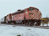 CP Rail FP7-A 4068 and GP-9 8528 power CP Rail train #11 - 'The Canadian' - on the approach to Bolton, January 1978 Kodak Kodakcolor II negative by S.Danko.
