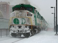 The show must GO on.
Amid a snowstorm that, by the rest of Canada's standards would be considered a light snowfall, but by Toronto standards a minor storm like this results in hour long delays on the highway, car crashes and I'm sure a few drivers went into the ditch- However, GO Transit train 919 shoves out of Oakville Station right on time with a pair of F59s providing the power.  