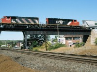 CN 9574, with the 594, passing over the CP Cartier sub at Sudbury, ONT.   9/15/2002