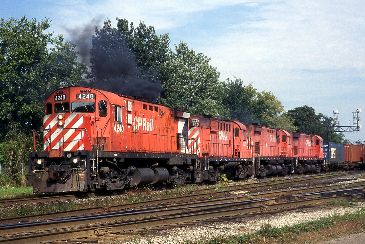 Late in their careers, four CP MLW’s smoke it up on 509 departing London. These locomotives haven’t fared too well. CP 4240 went to the Morristown & Erie and was later scrapped, CP 1825 went to the Minnesota Commercial but doesn’t seem to get much use, CP 4242 went to the Arkansas & Missouri and has been used as a parts source, and CP 4216 also went to the Morristown & Erie where it sits stored, covered in graffiti.
