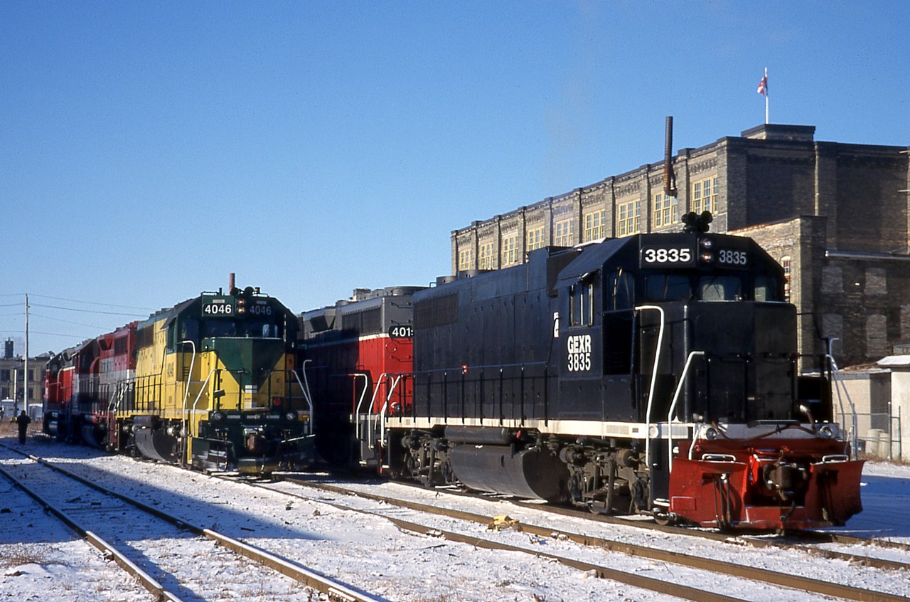 Here's some more GEXR variety shortly after the lease of the Guelph Sub. began. GEXR 3835 and 4019 sit with GEXR 700 and 901 out of sight, while on the adjacent track GEXR 4046, EMDX 205 and GEXR 4022 are coupled in to a consist.