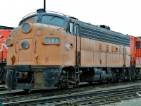 The future Go Transit 911 (former MILW 104A ) on a lay over at CN Mac Yard. I believe the date is either January 1989 or 1990. Kodachrome by S.Danko.
