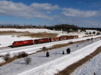 A north bound CP train led by #9386 is seen traveling through the Townline Tunnel Cut. It will soon duck under the Welland Canal and procced to Welland Yard. First train of the new year.
