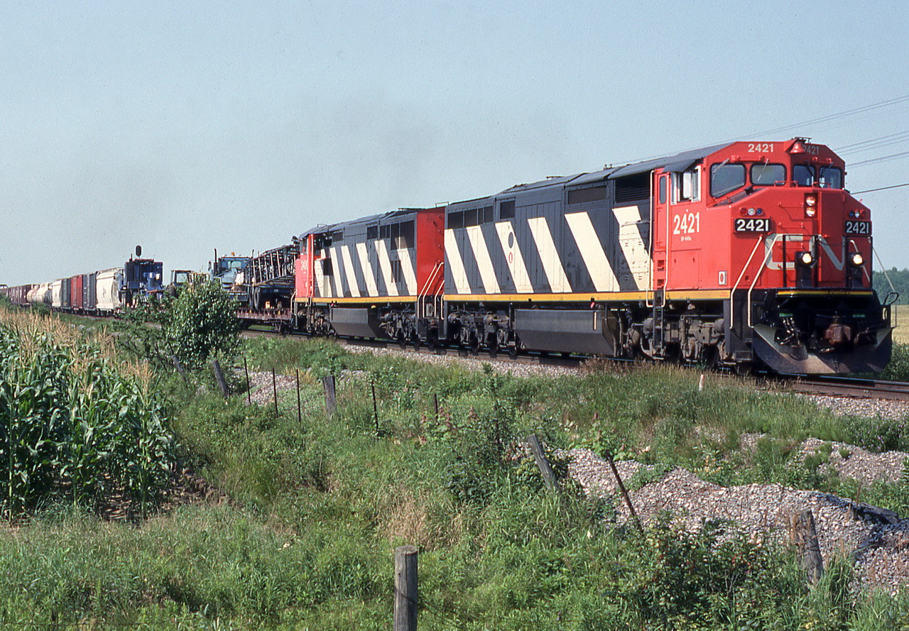 CN 330 with a wide load in the consist just warned an oncoming train about it.