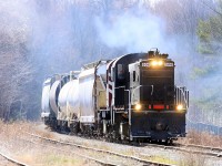 Bruce-ster lays down a smoke screen as he passes the Sharpe Feed Mill siding at Moffat, heading for Guelph on this chilly April morning.