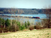 Afternnon westbound #245 running a bit late, with CP 9352 leading a blue CEFX over the Mountsberg Causeway. The ice is mostly melted and spring is not far off.