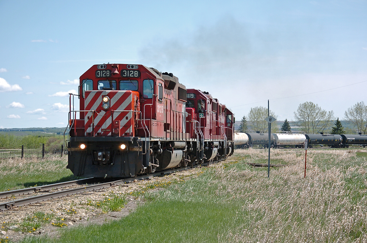 This was the longest train on the Hoadley sub that I'd seen all year during 2012. The year saw the return of somewhat-regular traffic (Tuesdays and Fridays is what they generally tried to do). Pulled by three locos rather than the usual two, the train went the 42.8 miles to Rimbey Gas Plant with ~25 cars, but returned with zero.