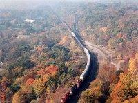 The anticipated beautiful day was almost as advertised, save for a stubborn haze in the distance, as NS autoparts train #328 made its way eastward down the grade at Dundas en route to Buffalo. Power is CP 5585, NS 6118, CP 5511 as witnessed from Dundas Peak.  Alas, even this location is slowly deteriorating as a prime photo objective due to the increasing height of trees along the south side, which cast shadows over the tracks most of the mornings in the summer.