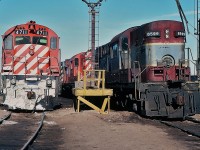 MLW rules - on this day - at CP Rail Agincourt. 
<br>
<br>
M636 #4711 shares the sand tower loading track with RS-10s #8599 ('b' end showing) and RS-18 #8730, the latter is the future #1808.
<br>
<br>
Q: Anyone know if #8599 was repainted CP Rail action red? 
And below 8599's head light, the " 11 20 79 " numbering - perhaps a repair date - purpose ?
<br>
<br>
January 20, 1980 Kodachrome by S.Danko.
<br>
<br>
More pure MLW on CP:
<br>
<br>
<a href="http://www.railpictures.ca/?attachment_id=7082"> two at Bolton </a> 
<br>
<br>
<a href="http://www.railpictures.ca/?attachment_id=6317"> two departing Agincourt west </a> 
<br>
<br>
<a href="http://www.railpictures.ca/?attachment_id=2245"> RS-10 at Agincourt </a> 
<br>
<br>
<a href="http://www.railpictures.ca/?attachment_id=2098"> two west at Leaside </a> 
<br>
<br>
<a href="http://www.railpictures.ca/?attachment_id=1864"> trio departing Agincourt east </a> 
<br>
<br>
<a href="http://www.railpictures.ca/?attachment_id=1863"> trio departing Agincourt east </a> 
<br>
<br>
<a href="http://www.railpictures.ca/?attachment_id=1835"> trio 244 primes at Guelph Jct </a> 
<br>
<br>
<a href="http://www.railpictures.ca/?attachment_id=1759"> different trio departing Agincourt east </a> 
<br>
<br>
sdfourty.
