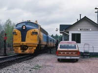 The O.N.R. Northlander with FP7m #1987 (ex #1510) is CN train #122 at CN Alderdale Subdivison mile 51.5; #122 is following instructions within CN Timetable Footnotes 1.1 and 2.23 "Nipissing - all trains may register by register ticket" and "Operator Nipissing is in charge of junction switch" - prior to entering the CN Newmarket Subdivision at mile 217.9 on May 23, 1983. Kodachrome by S.Danko. 