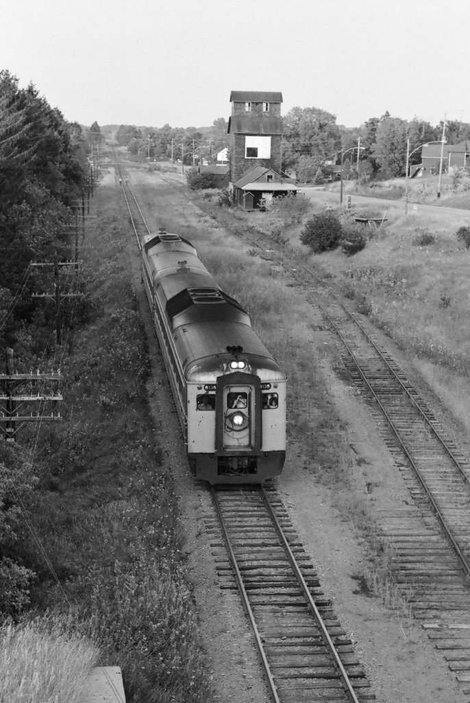 Via killed the passenger train - multiple times - per the insistence of the Trudeau, then Mulroney governments: The on / off Havelock Budd car train at Pontypool / on again by 1986 / then off - killed for good - in 1990. The Via Rail June 1 1982 timetable states " Last trip September 6 "; so here is Via train 189 with Via 6135. Amazingly the view from the highway 35 bridge has not changed significantly in 31 years - what you cannot see is that the track speed that was 60 mph - is now 15 mph, such is progress? Negative by S.Danko.