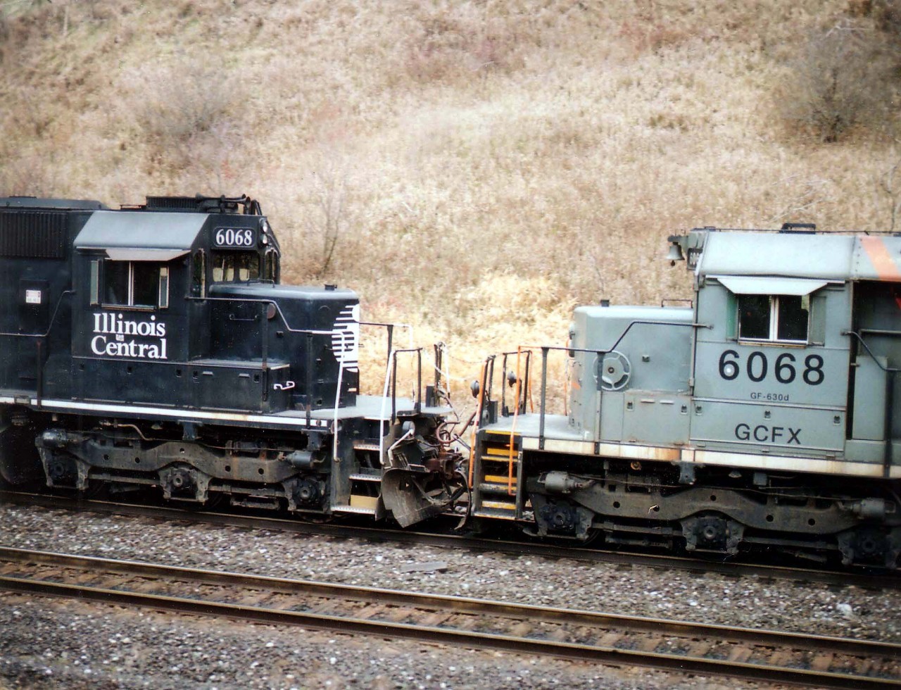 It Has to Happen, Dept:  Train #399 with CN 5530 leader almost cresting the grade at Copetown, it was rather startling to see the trailing two units.  Both the same number!!!  IC 6068 and GCFX 6068 made for one rare combination and a very unusual photo.