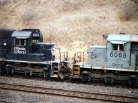 It Has to Happen, Dept:  Train #399 with CN 5530 leader almost cresting the grade at Copetown, it was rather startling to see the trailing two units.  Both the same number!!!  IC 6068 and GCFX 6068 made for one rare combination and a very unusual photo.