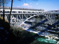 Amtrak 324 with Toronto to New York City train 97, The Maple Leaf, crosses high above the Niagara River on the Whirlpool Rapids Bridge. 