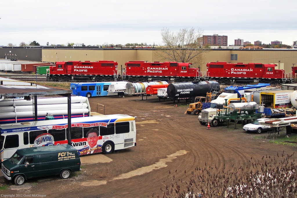 leaving the yard late T08 rolls past a truck yard in Scarborough Ontario.