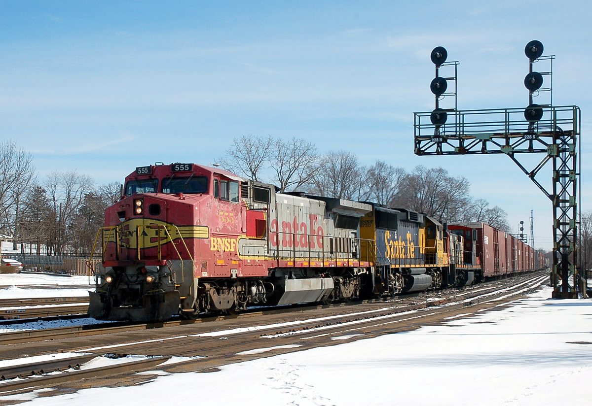 CN 399 comes by Brantford with an oddball consist of BNSF 555 - BNSF 8720 - CN 1436 and 97 cars
