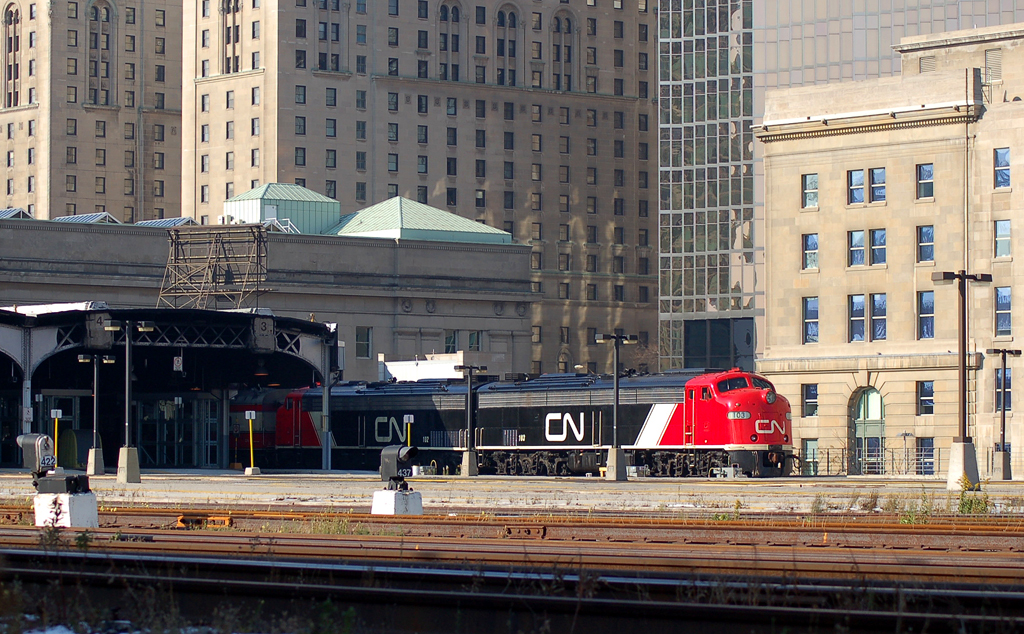 CN Grey Cup extra train sits outside the east end of Union Station with CN 103 - CN 102 and coaches CN 1057, CN 1061, IC 800210, CN 1058, CN 1059 and CN 1060