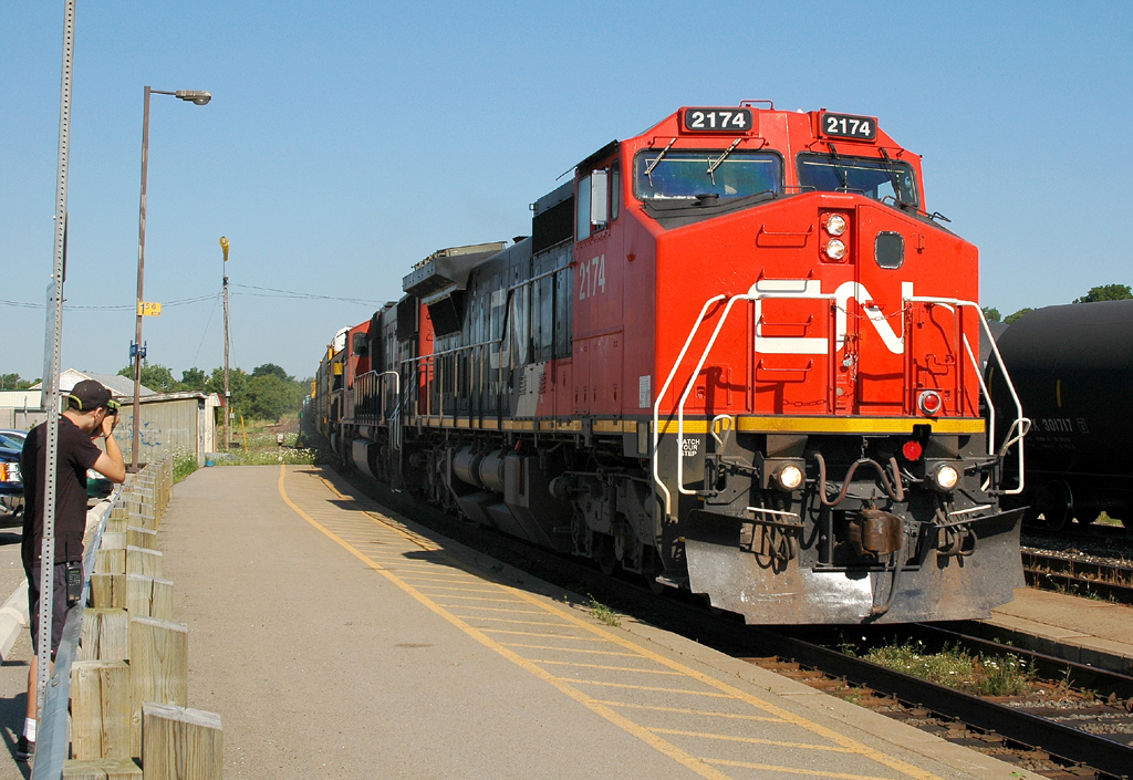 382 passing Brantford with CN 2174 - CN 5738 - IC 1020 as fellow RP contributer Joseph Bishop grabs his picture (photo ID 4455)