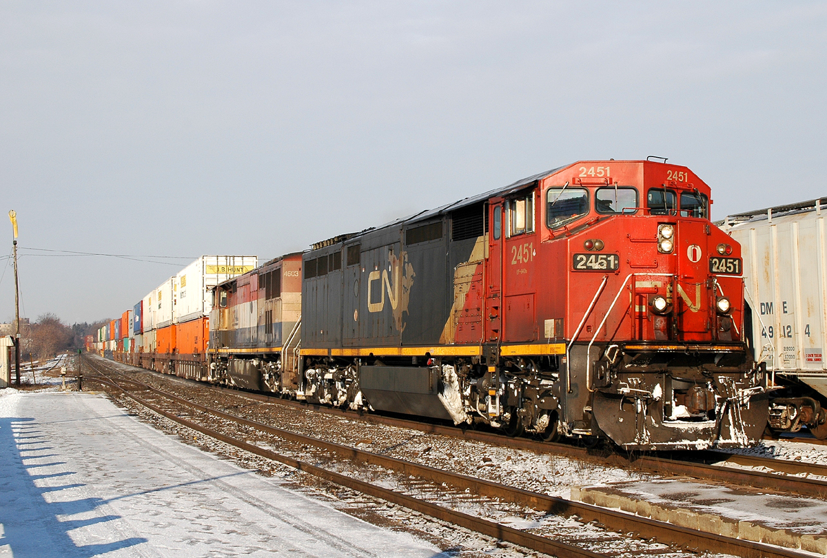 CN 148 rolls by Brantford with CN 2451 - BCOL 4603 leading the way