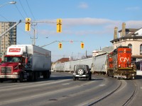 CN 4138 workig it's way down Clarence street with 7 hoppers for Ingenia