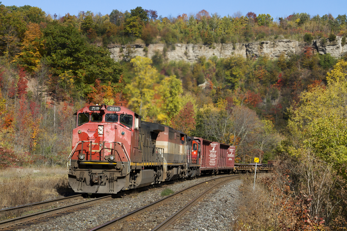 Autumn in Southern Ontario last year brought out some spectacular foliage, as evidenced in this photo as CN 435 gets a grip on the hill at Dundas with an interesting trio of power.