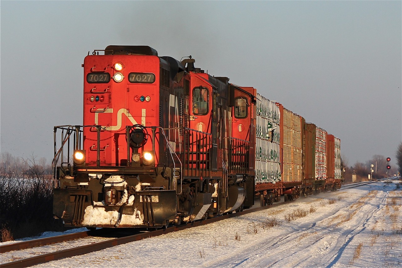 Was headed East of Chatham to shoot VIA 73 at CN Northwood when I looked to my left and saw CN 439 with both units running long hood forward; with nothing else to do I turned around and headed West to catch it leaving town just passed Ringold Diamond. As of now this lash-up may be rather stale to the railfans of the area but the day will come when sights like this will be a thing of history.