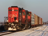 Was headed East of Chatham to shoot VIA 73 at CN Northwood when I looked to my left and saw CN 439 with both units running long hood forward; with nothing else to do I turned around and headed West to catch it leaving town just passed Ringold Diamond. As of now this lash-up may be rather stale to the railfans of the area but the day will come when sights like this will be a thing of history.