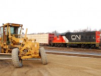 CN 580 emerges from behind a Champion Grader which was being used to grade the new station platform