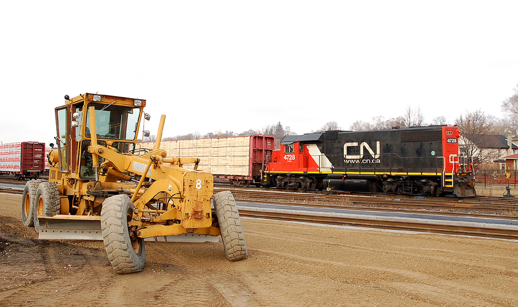 CN 580 emerges from behind a Champion Grader which was being used to grade the new station platform