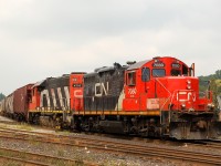 X555, an equipment move from Stelco is ready to depart Brantford for Hamilton with CN 7080 - CN 4710 on the head end