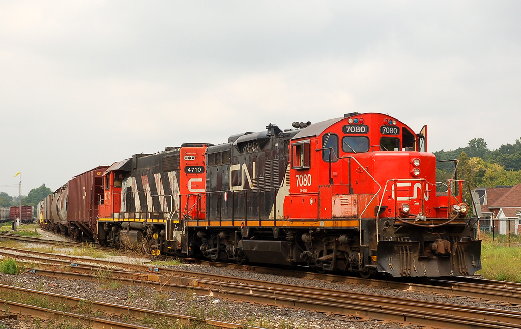 X555, an equipment move from Stelco is ready to depart Brantford for Hamilton with CN 7080 - CN 4710 on the head end
