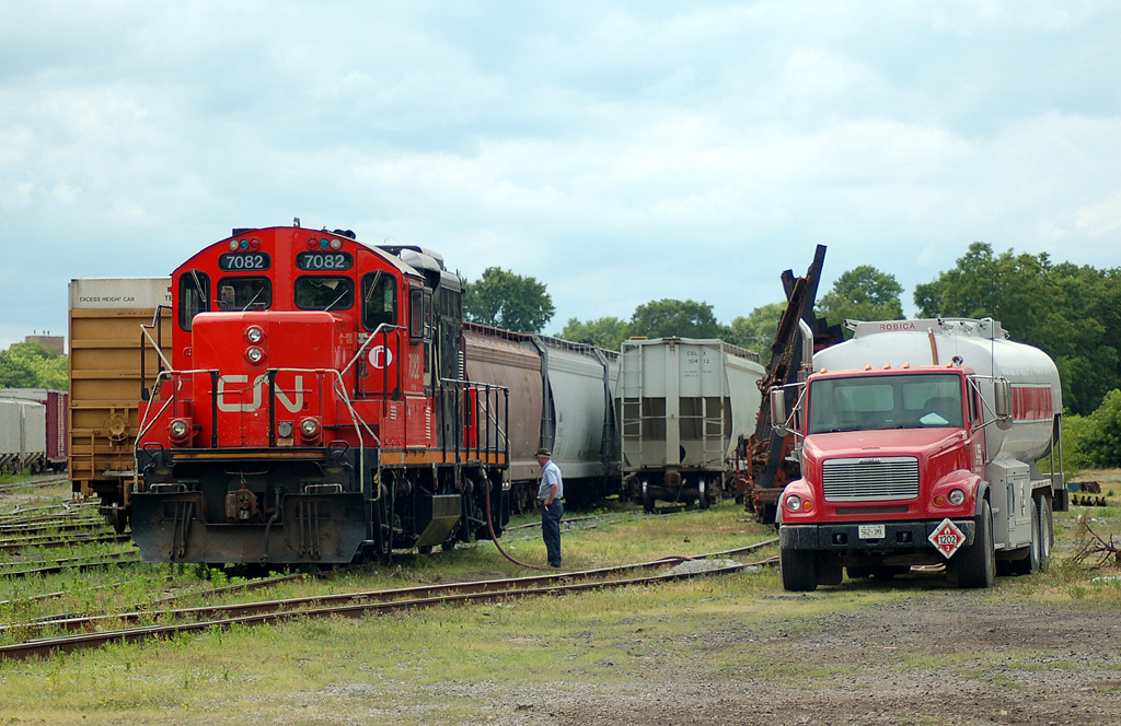 CN 7082 takes a drink of diesel from a T H Lee Petroleum tanker truck