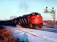 Late afternoon on a bitterly cold day in January 1981 as VIA #75, with leader 6536 still in CN colours with the "CN" painted out leads sister 6530 westbound onto the Dundas Sub thru Bayview Junction. And one can see the photographer will live on in his own shadow. :o)