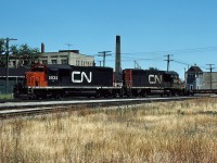 At the junction with the former L&PS, CN 5032 and 5074 power a westbound freight through London.