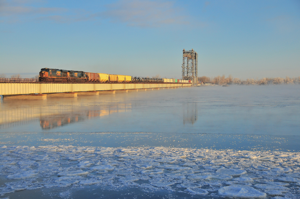 By a crispy day, CN 327 is emerging of the morning fog in the first rays of the sun.